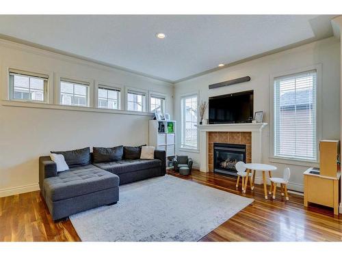 3-2326 2 Avenue Nw, Calgary, AB - Indoor Photo Showing Living Room With Fireplace