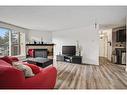 2105-13045 6 Street Sw, Calgary, AB  - Indoor Photo Showing Living Room With Fireplace 