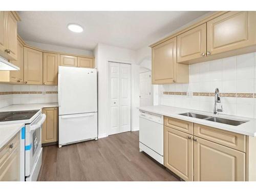 95 Taracove Estate Drive Ne, Calgary, AB - Indoor Photo Showing Kitchen With Double Sink