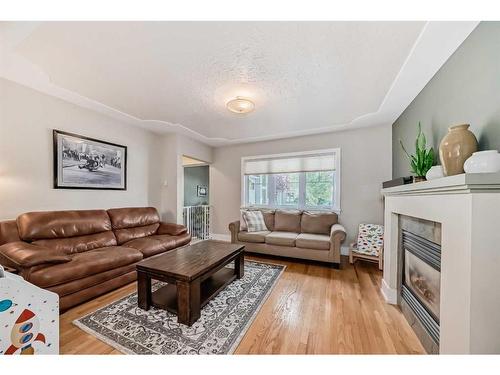 1728 Westmount Road Nw, Calgary, AB - Indoor Photo Showing Living Room With Fireplace