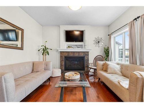 1425 Ranch Road, Carstairs, AB - Indoor Photo Showing Living Room With Fireplace