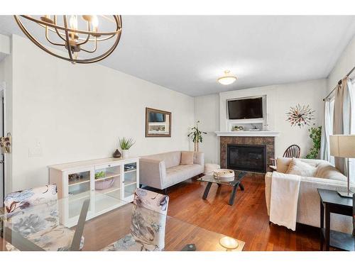 1425 Ranch Road, Carstairs, AB - Indoor Photo Showing Living Room With Fireplace