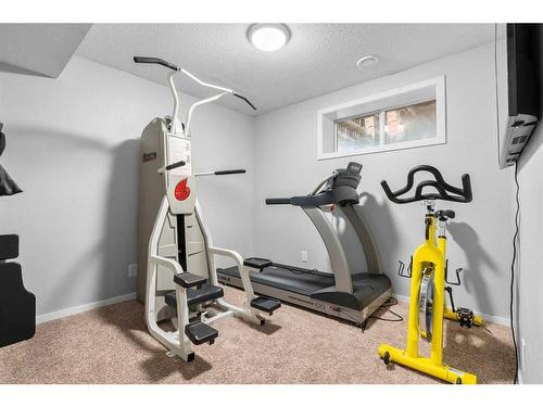 1425 Ranch Road, Carstairs, AB - Indoor Photo Showing Gym Room