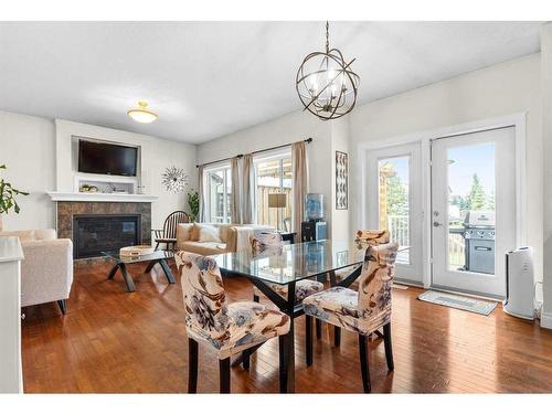 1425 Ranch Road, Carstairs, AB - Indoor Photo Showing Dining Room With Fireplace