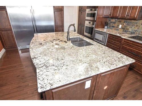 61 Big Hill Springs Estates, Rural Rocky View County, AB - Indoor Photo Showing Kitchen With Double Sink With Upgraded Kitchen