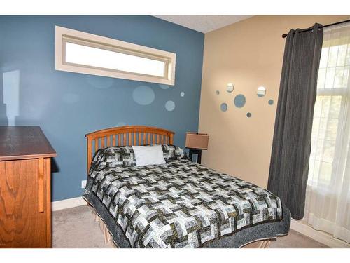 61 Big Hill Springs Estates, Rural Rocky View County, AB - Indoor Photo Showing Bedroom