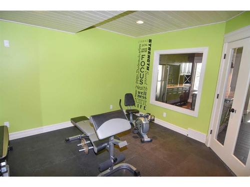 61 Big Hill Springs Estates, Rural Rocky View County, AB - Indoor Photo Showing Gym Room