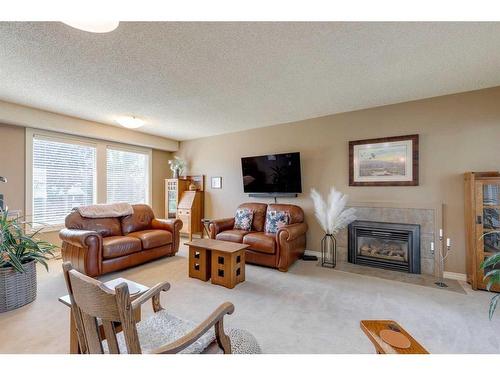 407 Whiteridge Crescent Ne, Calgary, AB - Indoor Photo Showing Living Room With Fireplace