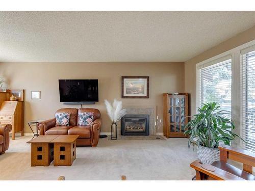 407 Whiteridge Crescent Ne, Calgary, AB - Indoor Photo Showing Living Room With Fireplace