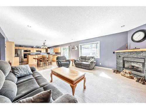 7819 34 Avenue Nw, Calgary, AB - Indoor Photo Showing Living Room With Fireplace