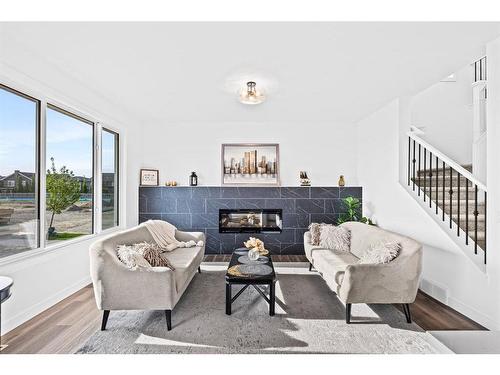 935 Langholm Drive Se, Airdrie, AB - Indoor With Fireplace