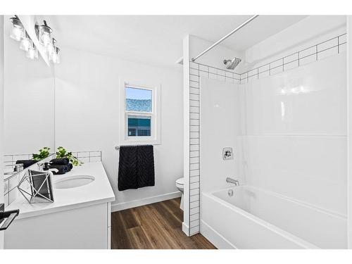 935 Langholm Drive Se, Airdrie, AB - Indoor Photo Showing Bathroom