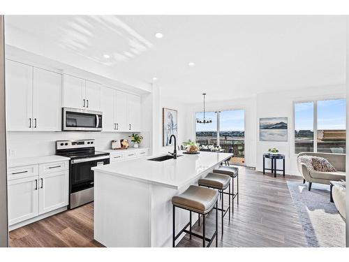 935 Langholm Drive Se, Airdrie, AB - Indoor Photo Showing Kitchen With Stainless Steel Kitchen With Upgraded Kitchen