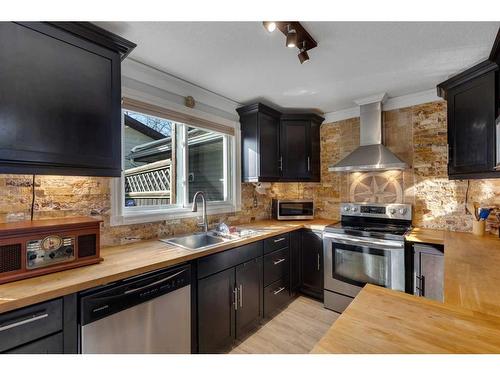 28 Bermondsey Rise Nw, Calgary, AB - Indoor Photo Showing Kitchen With Stainless Steel Kitchen With Double Sink