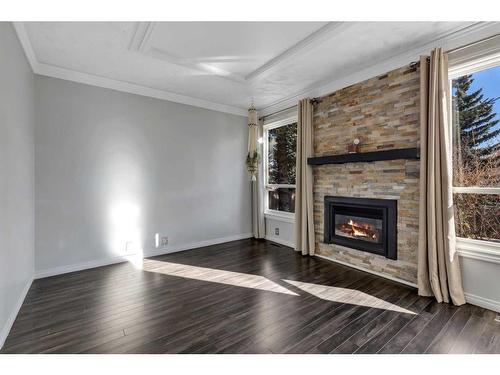 28 Bermondsey Rise Nw, Calgary, AB - Indoor Photo Showing Living Room With Fireplace