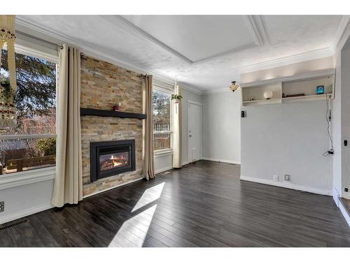 28 Bermondsey Rise Nw, Calgary, AB - Indoor Photo Showing Living Room With Fireplace