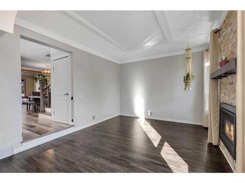 28 Bermondsey Rise Nw, Calgary, AB - Indoor Photo Showing Other Room With Fireplace