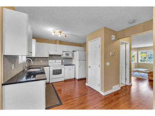 118 Royal Birch Villas Nw, Calgary, AB - Indoor Photo Showing Kitchen With Double Sink