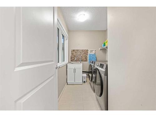 60 Brightoncrest Point Se, Calgary, AB - Indoor Photo Showing Laundry Room