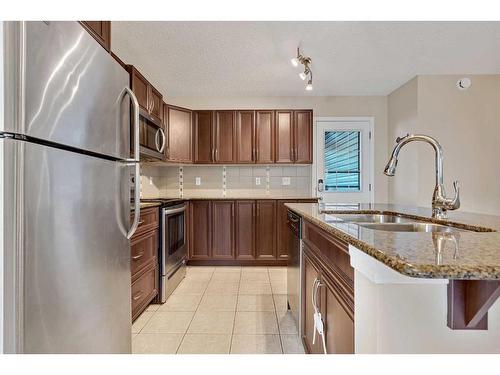 1017 Kingston Crescent Se, Airdrie, AB - Indoor Photo Showing Kitchen With Double Sink