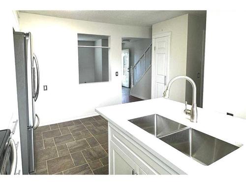 74 Pennsburg Way Se, Calgary, AB - Indoor Photo Showing Kitchen With Double Sink