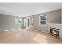 102-417 3 Avenue Ne, Calgary, AB  - Indoor Photo Showing Living Room With Fireplace 