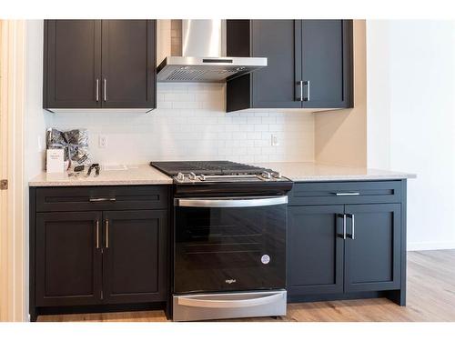 1309 Bayview Point Sw, Airdrie, AB - Indoor Photo Showing Kitchen