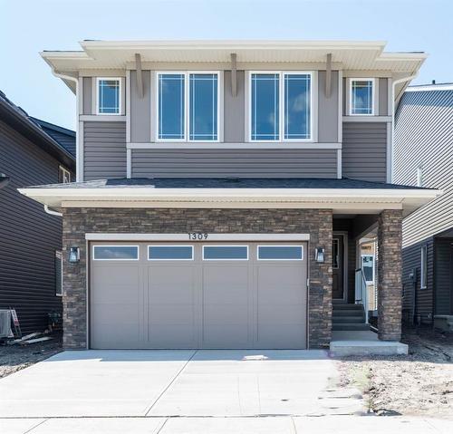 1309 Bayview Point Sw, Airdrie, AB - Outdoor With Facade