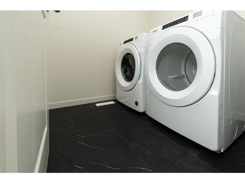 1309 Bayview Point Sw, Airdrie, AB - Indoor Photo Showing Laundry Room