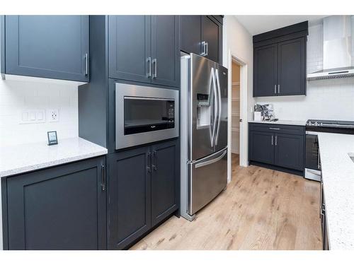 1309 Bayview Point Sw, Airdrie, AB - Indoor Photo Showing Kitchen With Stainless Steel Kitchen