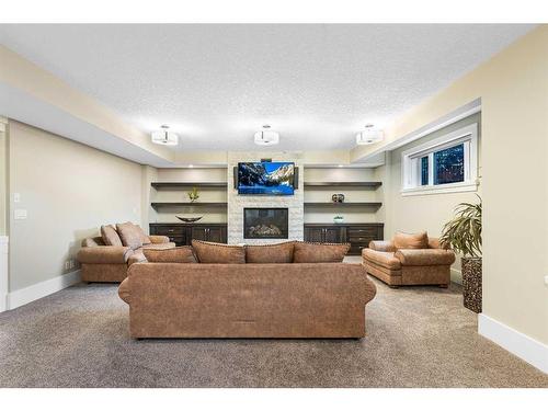 32 Aspen Ridge Manor Sw, Calgary, AB - Indoor With Fireplace