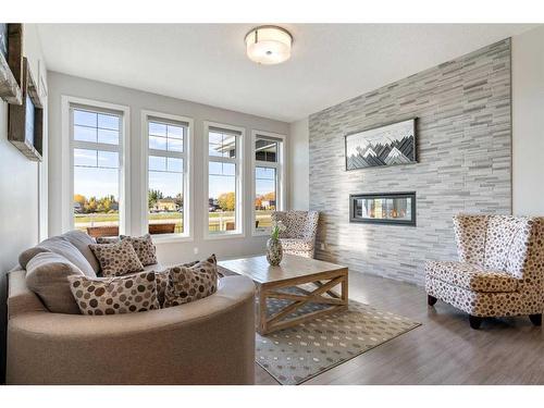 162 Ranch Road, Okotoks, AB - Indoor Photo Showing Living Room With Fireplace