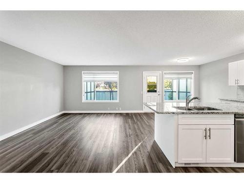 16161 Shawbrooke Road Sw, Calgary, AB - Indoor Photo Showing Kitchen With Double Sink