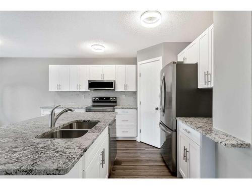 16161 Shawbrooke Road Sw, Calgary, AB - Indoor Photo Showing Kitchen With Double Sink With Upgraded Kitchen