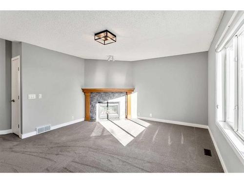 16161 Shawbrooke Road Sw, Calgary, AB - Indoor With Fireplace