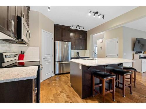 73 Kingsbridge Place Se, Airdrie, AB - Indoor Photo Showing Kitchen With Upgraded Kitchen