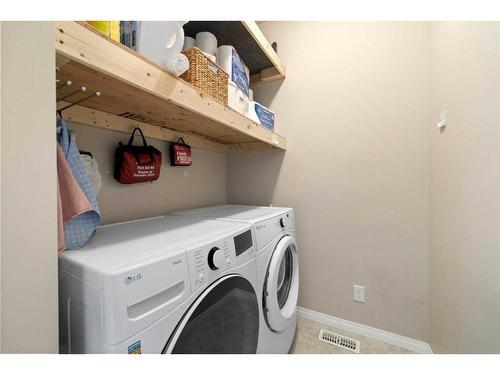 73 Kingsbridge Place Se, Airdrie, AB - Indoor Photo Showing Laundry Room