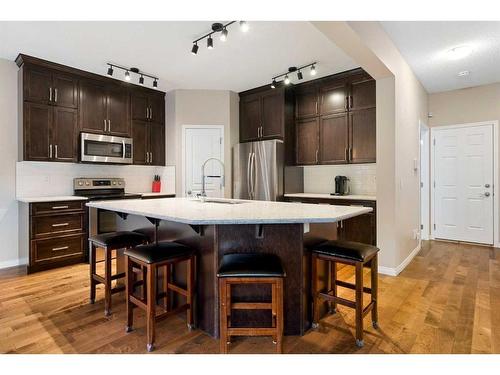 73 Kingsbridge Place Se, Airdrie, AB - Indoor Photo Showing Kitchen With Upgraded Kitchen