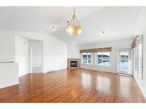 159 Westlake Bay, Strathmore, AB - Indoor Photo Showing Living Room With Fireplace