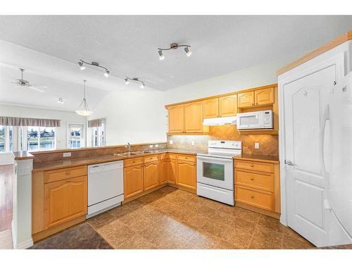 159 Westlake Bay, Strathmore, AB - Indoor Photo Showing Kitchen With Double Sink