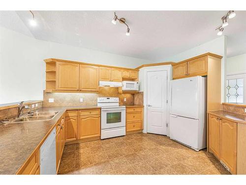 159 Westlake Bay, Strathmore, AB - Indoor Photo Showing Kitchen With Double Sink