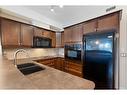 344-26 Val Gardena View Sw, Calgary, AB  - Indoor Photo Showing Kitchen With Double Sink 