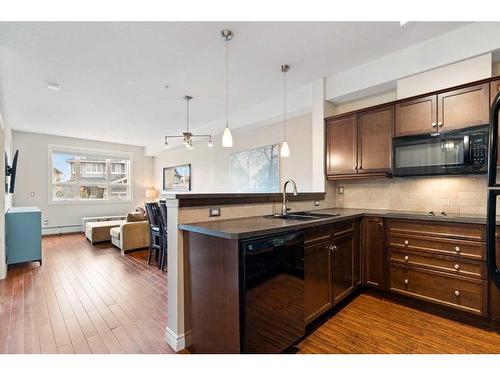 344-26 Val Gardena View Sw, Calgary, AB - Indoor Photo Showing Kitchen With Double Sink