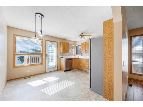 71 Quigley Drive, Cochrane, AB - Indoor Photo Showing Kitchen