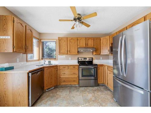 71 Quigley Drive, Cochrane, AB - Indoor Photo Showing Kitchen With Double Sink