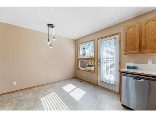 71 Quigley Drive, Cochrane, AB - Indoor Photo Showing Kitchen