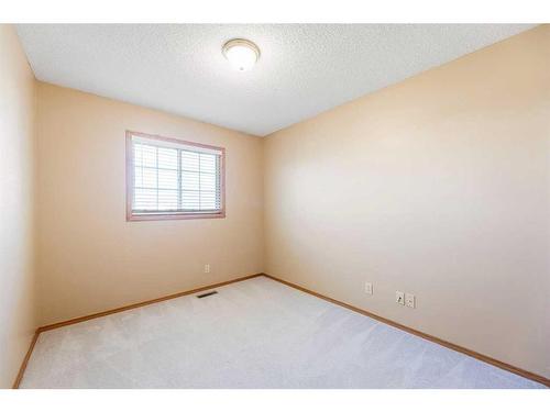 71 Quigley Drive, Cochrane, AB - Indoor Photo Showing Other Room