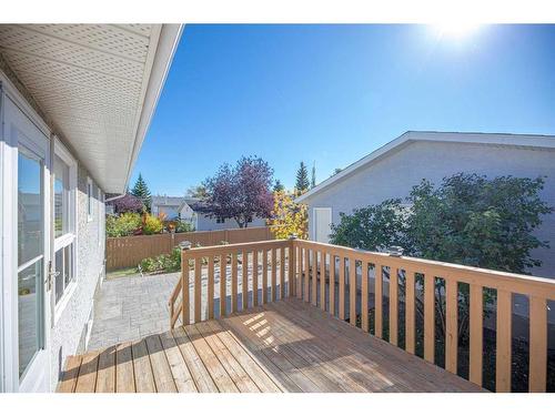 71 Quigley Drive, Cochrane, AB - Outdoor With Deck Patio Veranda With Exterior