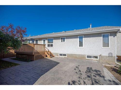 71 Quigley Drive, Cochrane, AB - Outdoor With Deck Patio Veranda