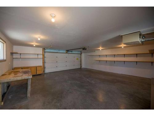 71 Quigley Drive, Cochrane, AB - Indoor Photo Showing Garage